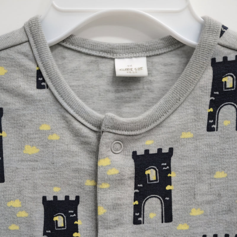 Playful Castle Print Baby Romper – Soft Gray Cotton Blend